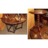 A early 20th century oak barley twist dining table and a carved mahogany tripod table