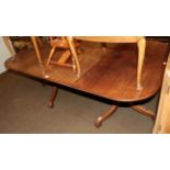 A 19th century mahogany D-end dining table with a single leaf raised on twin tripod bases, 185cm