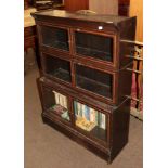 An early 20th century oak bookcase with glazed doors