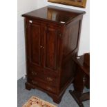 A reproduction oak linen fold bureau and a reproduction oak audio cabinet (2)