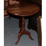 An 18th century oak tilt-top table