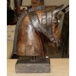 A Carved Model of a horse head in the manner of a carousel horse, realistically modelled and on a