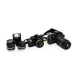 Nikon EM Camera With Series E Lens f1.8 50mm together with Series E lenses f2.8 100mm and f2.8 28mm;