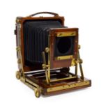 Gandolfi Plate Camera 5x4'' with mahogany body and brass fitting, black bellows have some splits,