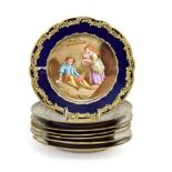 A Set of Five Sèvres Style Porcelain Cabinet Plates, late 19th century, painted with carousing