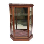 A Good Late Victorian Walnut Display Cabinet, circa 1880, of canted form with three-quarter