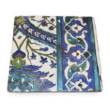 A Damascus Pottery Border Tile, circa 1580, painted in blue, green and turquoise with stylised