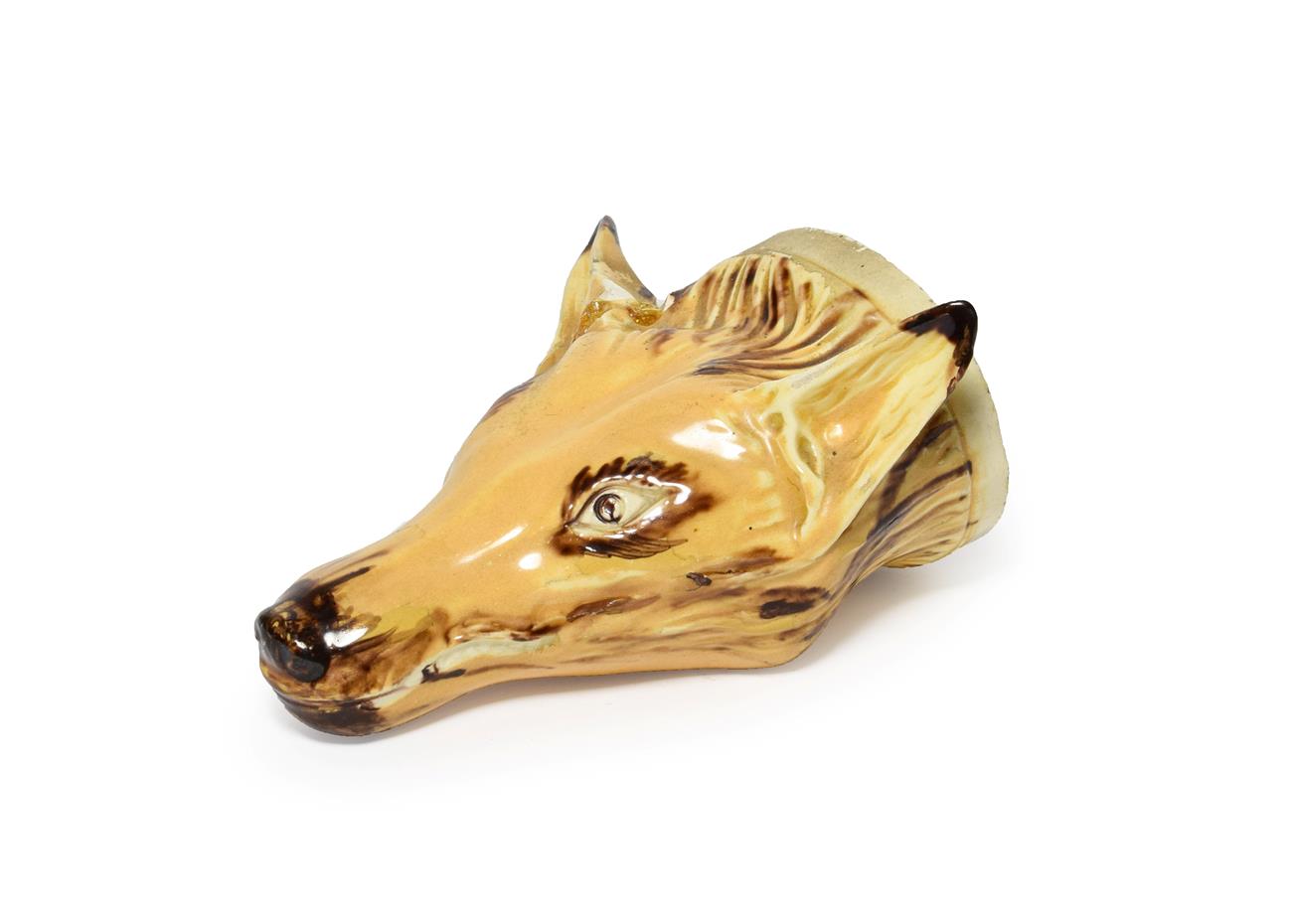 A Creamware Fox Mask Stirrup Cup, early 19th century, naturalistically modelled and picked out in