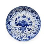 A Chinese Porcelain ''Lotus Bouquet'' Dish, in Yongle style, painted in underglaze blue with a