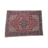 Heriz Rug of unusual size North West Iran, circa 1920 The tomato red field with typical indigo