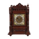 An Oak Quarter Striking Table Clock, circa 1890, top balustrade pediment, turned side columns,