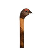 An Ian Taylor Grouse Walking Cane, the handle naturalistically carved and decorated as the head,