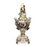 A Dresden Porcelain Flower Encrusted Vase, Cover and Stand, late 19th/early 20th century, of urn