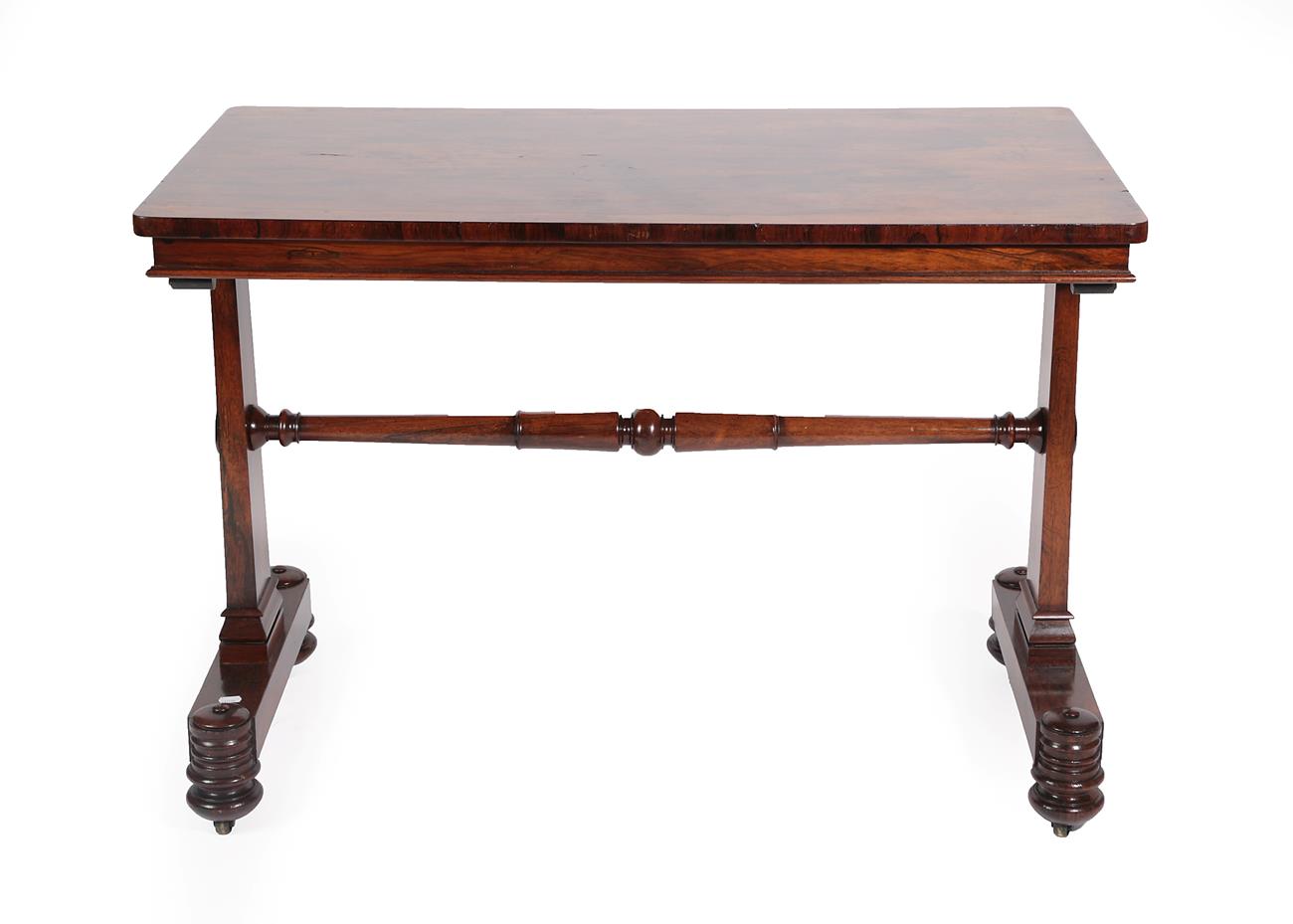 A William IV Rosewood Pillar-End Writing Table by T&G Seddon, circa 1840, of rectangular form with