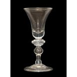 A Balustroid Wine Glass, circa 1740, the bell shaped bowl over an annular knop and stem with two