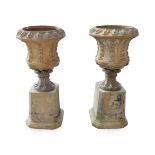 A Pair of Early Victorian Terracotta Campana Urns on Stands, circa 1842, cast with formal leaves and
