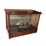 A Ship's Diorama, late 19th century, as a three-masted sailing ship in rough seas, in a glazed
