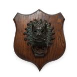 A Bronze Door Knocker, in Renaissance style, as the mask of a mythical beast, the ring with mythical