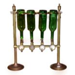 A Brass Drinks' Dispenser, late 19th/early 20th century, for four bottles, with urn finials,