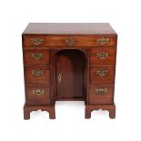 A George III Mahogany and Oak Lined Kneehole Dressing Table, late 18th century, the plain top