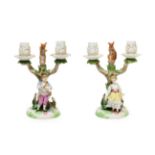 A Pair of Meissen Style Figural Candelabra, circa 1900, as a boy playing pipes and a girl dancing