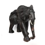 A Leather Covered Model of a Baby Elephant, possibly Liberty, 20th century, with glass eyes and