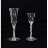 A Wine Glass, circa 1750, the rounded funnel bowl on an opaque twist stem and circular foot, 16cm