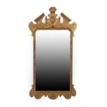 A George I Giltwood and Gesso Mirror, the original mirror plate contained within a rockwood border