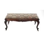 A Victorian Carved Rosewood Dressing Stool, 3rd quarter 19th century, covered in blue and floral