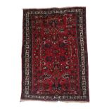 Persian Hamadan Rug West Iran, circa 1930 The blood red field of angular vines enclosed by narrow