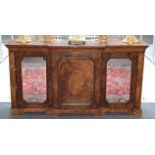 A Victorian Figured Walnut Breakfront Credenza, circa 1870, the moulded top above a central cupboard