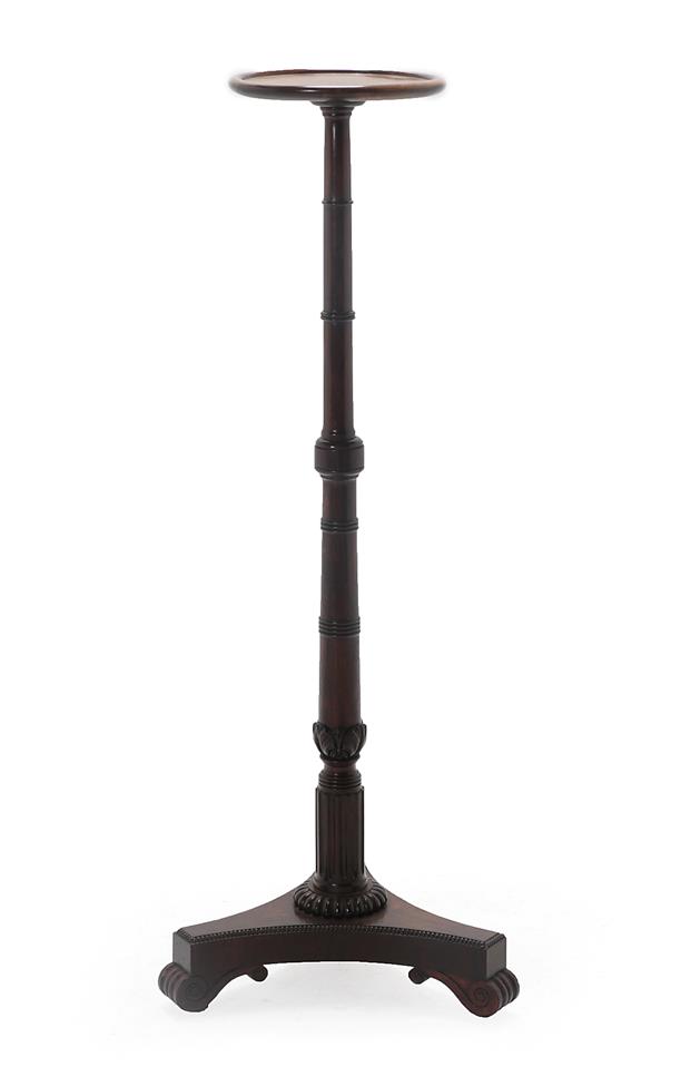 An Early 19th Century Rosewood Torchère, in the manner of Gillows, the circular dish top on a turned