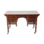 A Late Victorian Walnut Desk, with inset red and gilt leather writing surface and moulded edge above