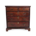 A George II Oak and Crossbanded Straight Front Chest of Drawers, 2nd quarter 18th century, the