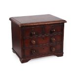 A Victorian Mahogany Box, in the form of a miniature chest of drawers, the two short and two long