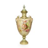 A Royal Worcester Porcelain Vase and Cover, 1897, the twin mask handles hung with swags, painted