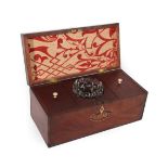 A George III Mahogany Tea Caddy, of rectangular form, inlaid with a shell patera, containing two