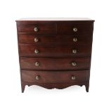 A George III Mahogany and Pine Sided Bowfront Chest of Drawers, late 18th century, with two short