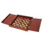 A Late Victorian Mahogany Cased Travelling Chess Set, of folding rectangular form, the interior with