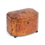 A Regency Tortoiseshell Tea Caddy, of canted bombé rectangular form, the domed cover set with a