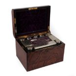 A Victorian Walnut Cased Travelling Toilet Set, of domed rectangular form, containing various