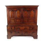 A Mid 18th Century Oak and Mahogany Crossbanded Livery Housekeeper's Cupboard, the moulded cornice