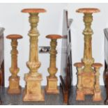 A Graduated Set of Six Cast Iron Pricket Candlesticks, late 19th century, with urn shaped sconces,