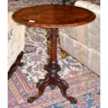A Victorian Burr Walnut Oval Tripod Table, circa 1870, the circular moulded top with barber's pole
