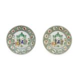 A Pair of Chinese Porcelain Plates, Kangxi style, painted in famille verte enamels with a family