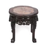 An Early 20th Century Chinese Padouk Wood and Pink Marble Plant Stand, with foliate carved border,