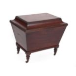 A Regency Mahogany Cellaret, early 19th century, of sarcophagus shape form, the moulded and