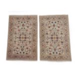 Unusual Pair of Kashan Rugs Central Iran, circa 1950 Each with a cream field with an allover
