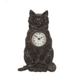 A Novelty Strut Desk Timepiece in the Form of a Cat, signed Ansonia, circa 1900, patinated bronze