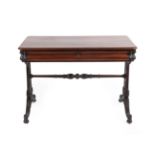 An Early Victorian Rosewood Writing Table, mid 19th century, of rounded rectangular form, the fitted